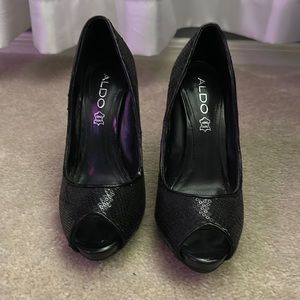 Aldo Sequin Black Heel. Size 6 small tear pictured.
